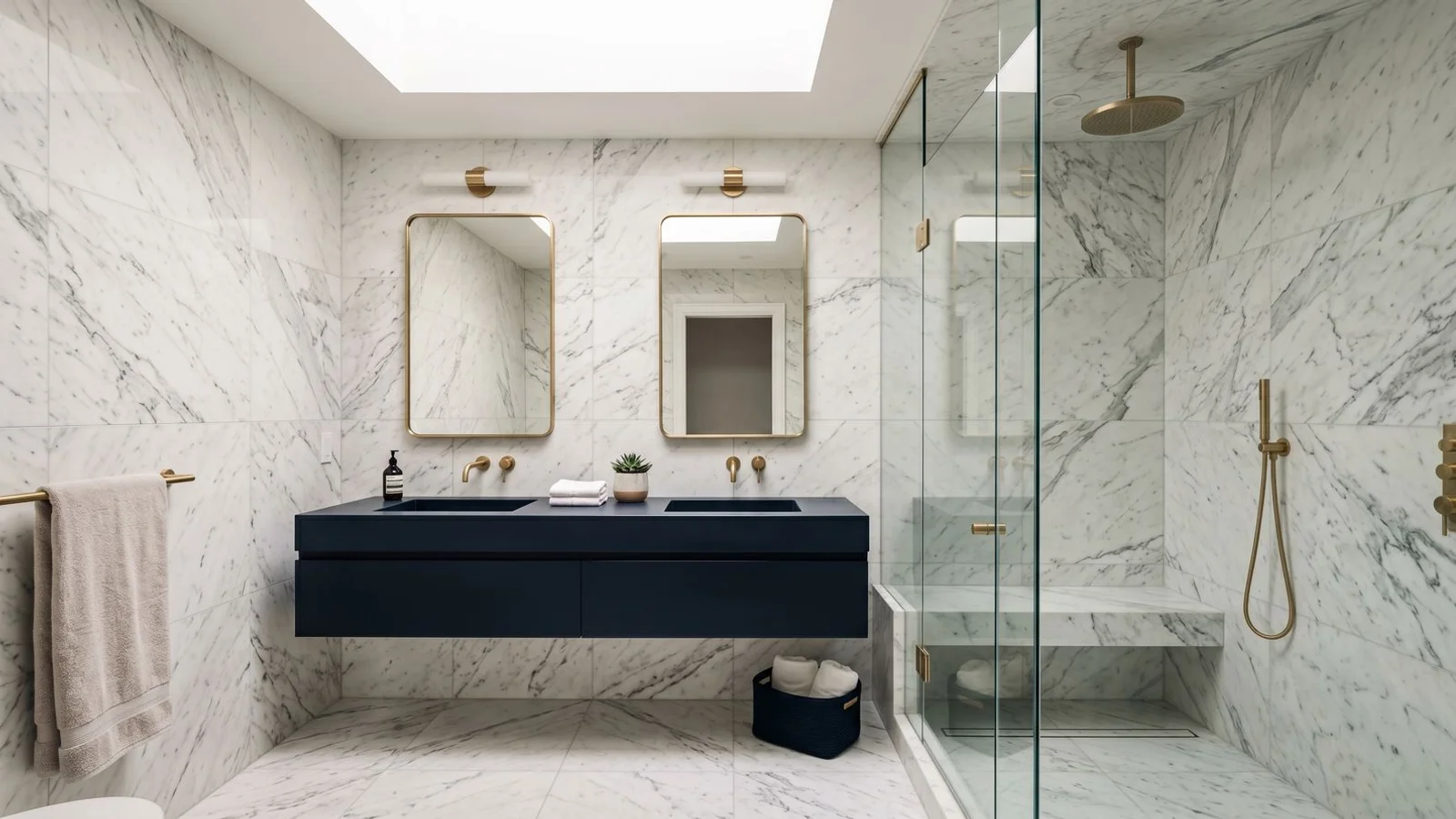 High-end Toronto bathroom with marble tile and brass fixtures